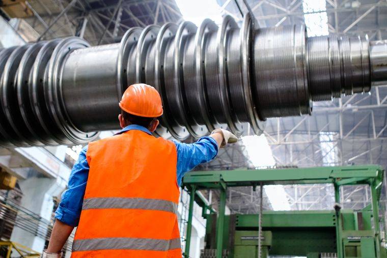 Marine engineer inspecting machinery