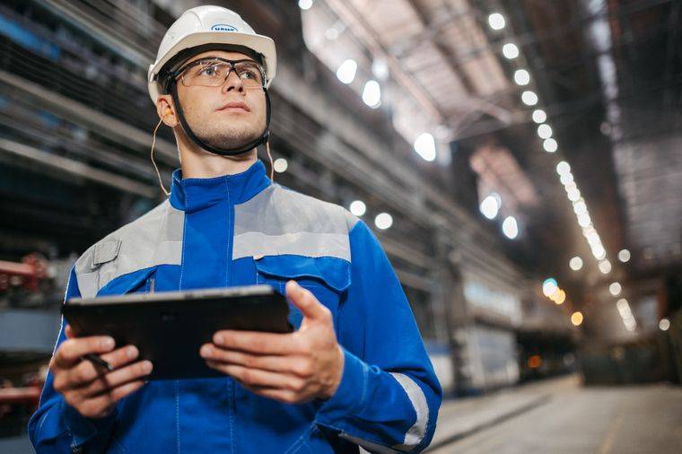 Engineer with tablet providing technical support