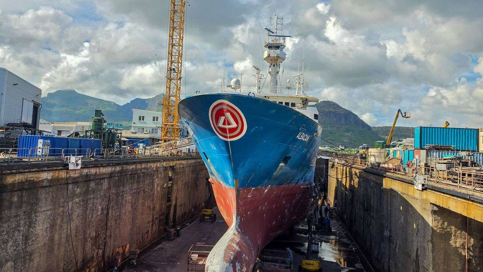 Vessel in dry dock with cranes